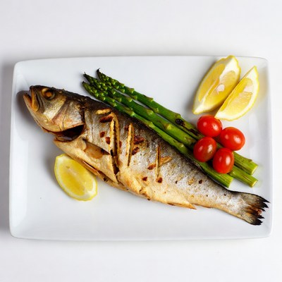 Grilled fish with vegetables and lemon