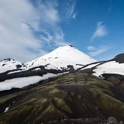 Snowy mountain landscape with clouds