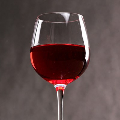 Red wine in a glass with dark background