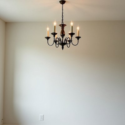 Chandelier hanging in an empty room