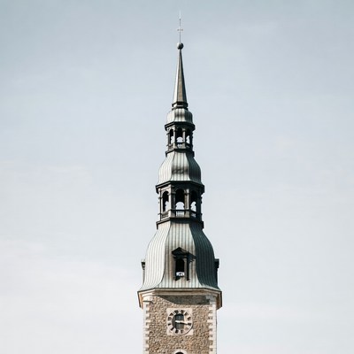 Tall tower features pointed roof design