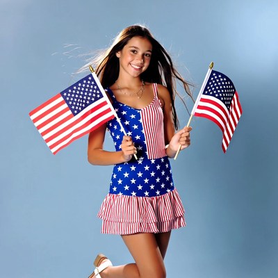 Girl holding flags for celebration