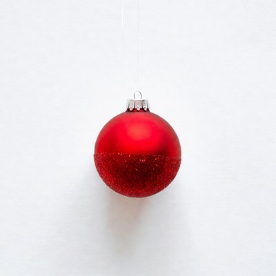 Red christmas ornament on white background