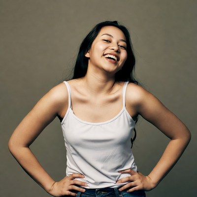 Smiling woman with hands on hips