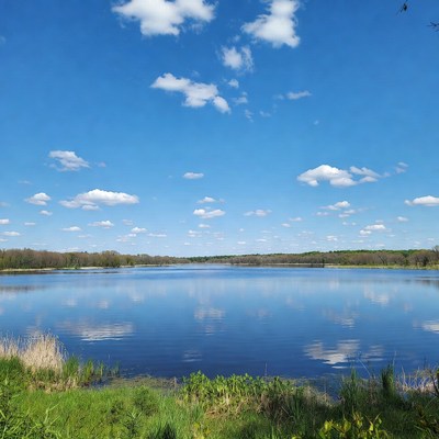 Bright blue sky over calm water