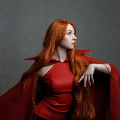 Woman in red cape with long hair