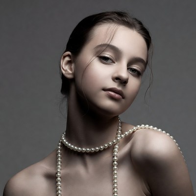 Young girl with pearls on neck