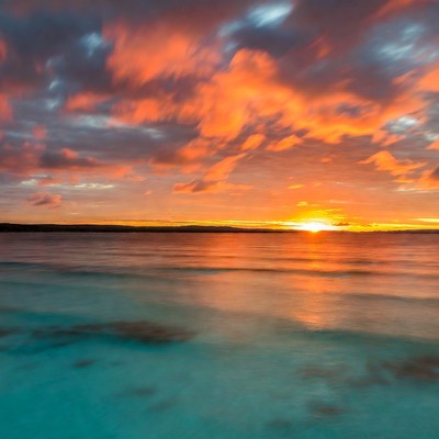 Sunset over ocean with colorful sky