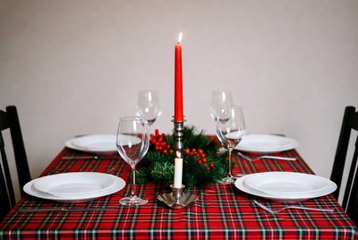Holiday dinner table setting with candle