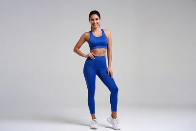 Fitness model poses in blue outfit