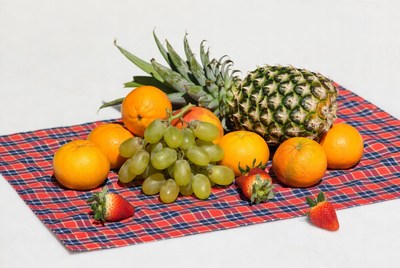Fresh fruit arrangement on checkered cloth