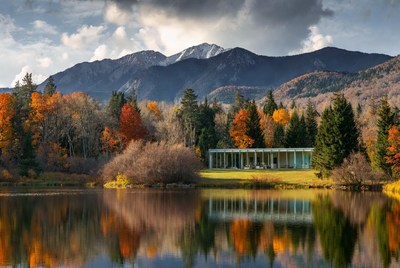 Scenic view of autumn landscape by water