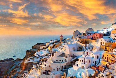 Sunset over santorini's white buildings