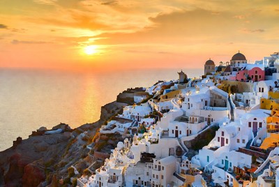 Sunset over santorini island coastline