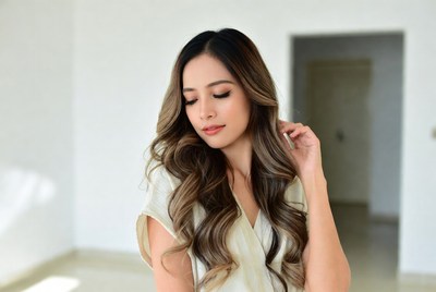 Young woman posing in bright room