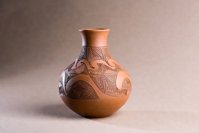 Handcrafted clay vase with designs