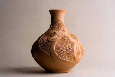 Handcrafted clay vase with designs