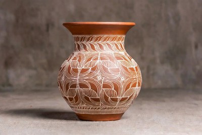 Clay jar with intricate designs