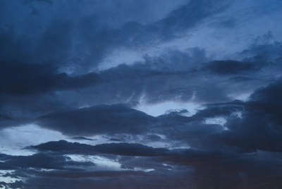 Dark clouds cover the sky at dusk