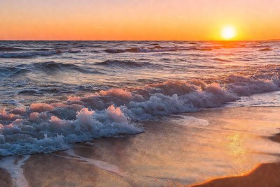 Sunset over the ocean waves
