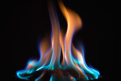 Bright flames dance in dark