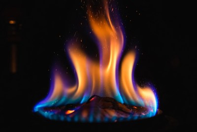 Colorful flames in darkness create light