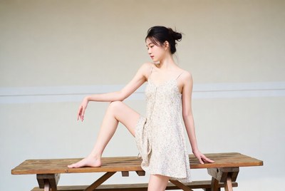 Model posing on wooden table