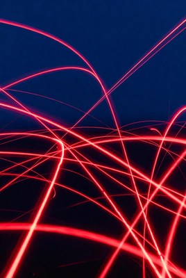 Bright red light patterns in dark space