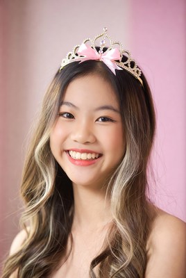 Girl wearing crown and smiling