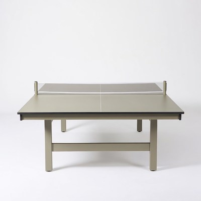 Ping pong table with net setup indoors