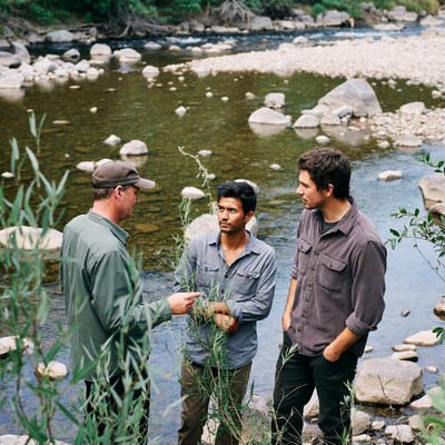 Discussion by the riverbank with friends