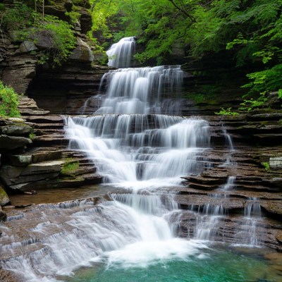 Waterfall flows down rocky steps