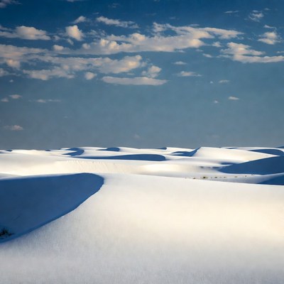 White sand dunes under blue sky
