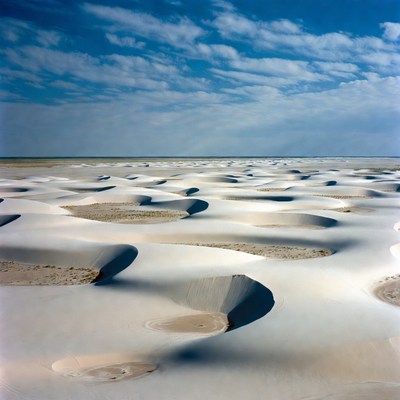Sand dunes under blue sky