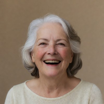 Smiling elderly woman in neutral space