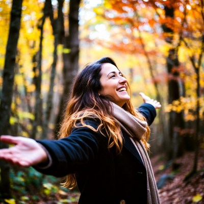Woman enjoys autumn in the woods