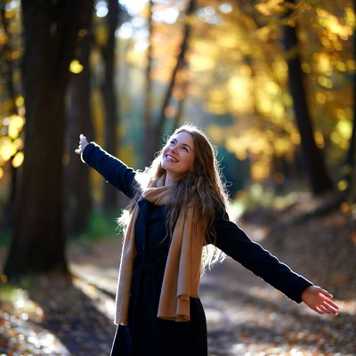 Woman enjoying autumn day outdoors