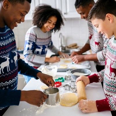 Family baking cookies for the holidays