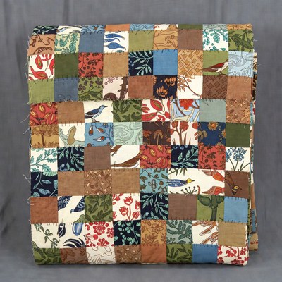 Quilt made with colorful patchwork squares