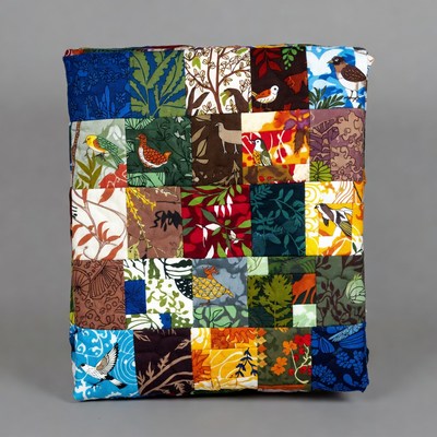 Colorful quilt with nature patterns displayed