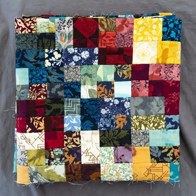 Colorful quilt made from various fabric pieces