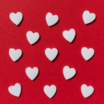 White hearts on red background