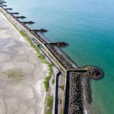 Coastal view of breakwaters and beach