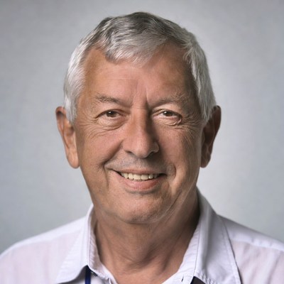 Smiling elderly man in white shirt