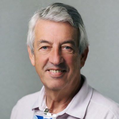 Smiling elderly man with ID badge