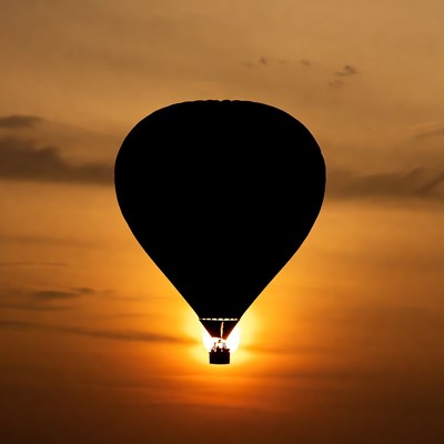 Hot air balloon silhouette at sunset