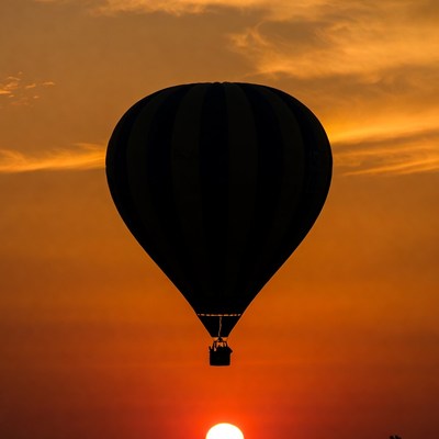 Hot air balloon silhouette at sunset