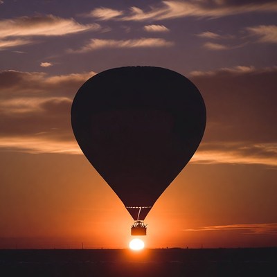 Hot air balloon silhouette at sunset