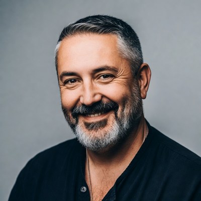 Smiling man with gray beard