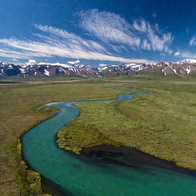 Turquoise River in Snowy Mountains
